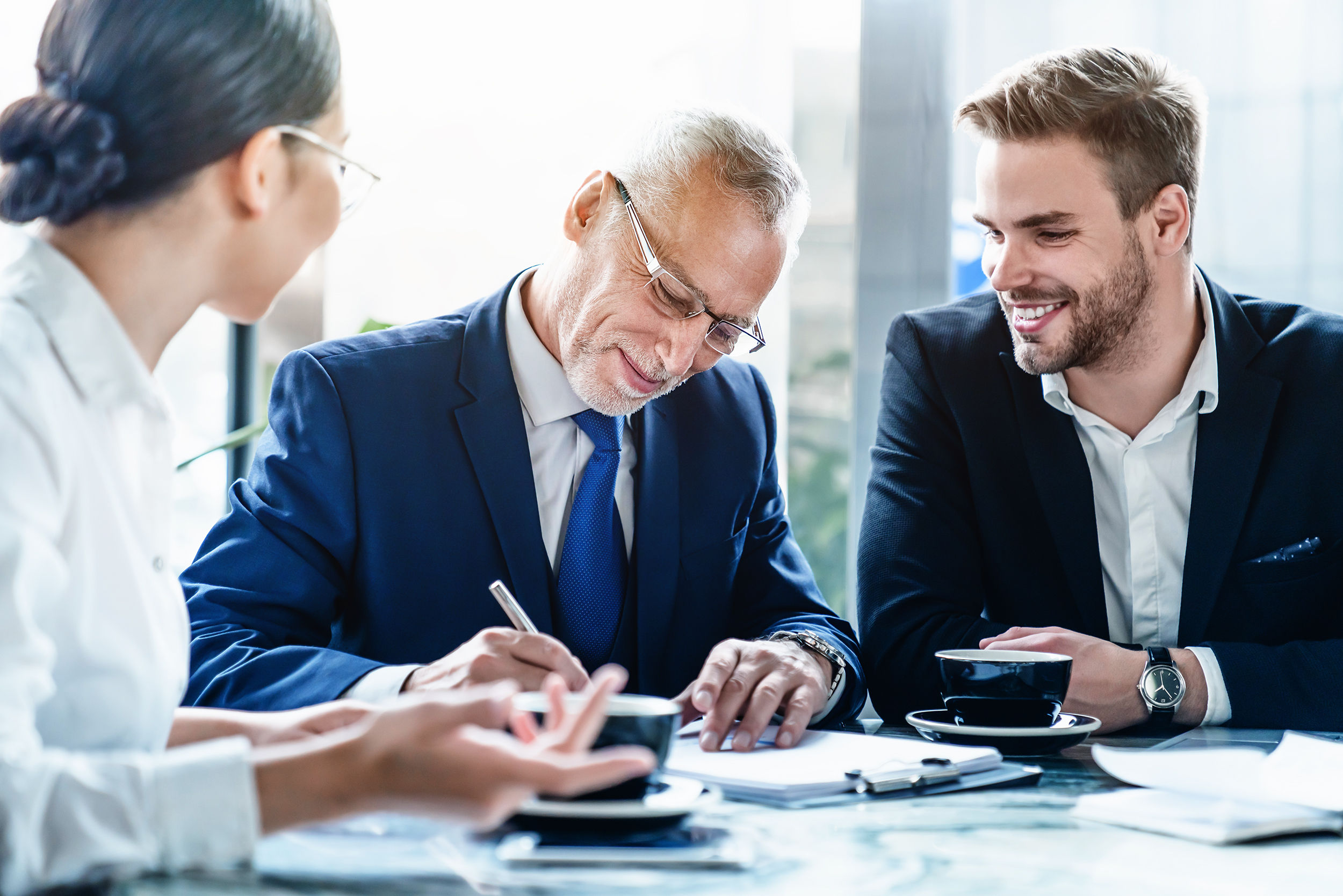 Businessman,Signing,Contract,At,Group,Meeting,In,Office.,Discussing,Contract